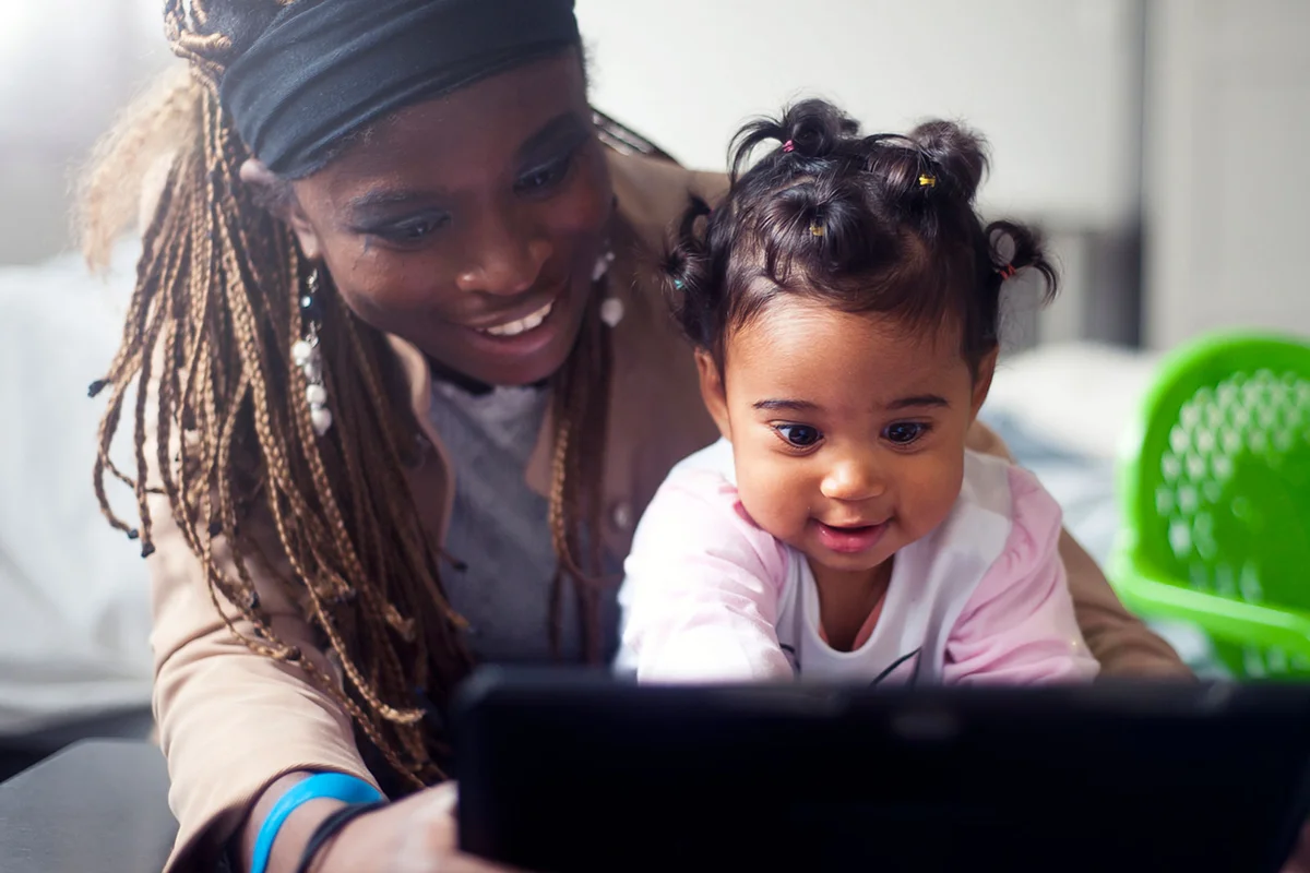 mother and daughter on computer