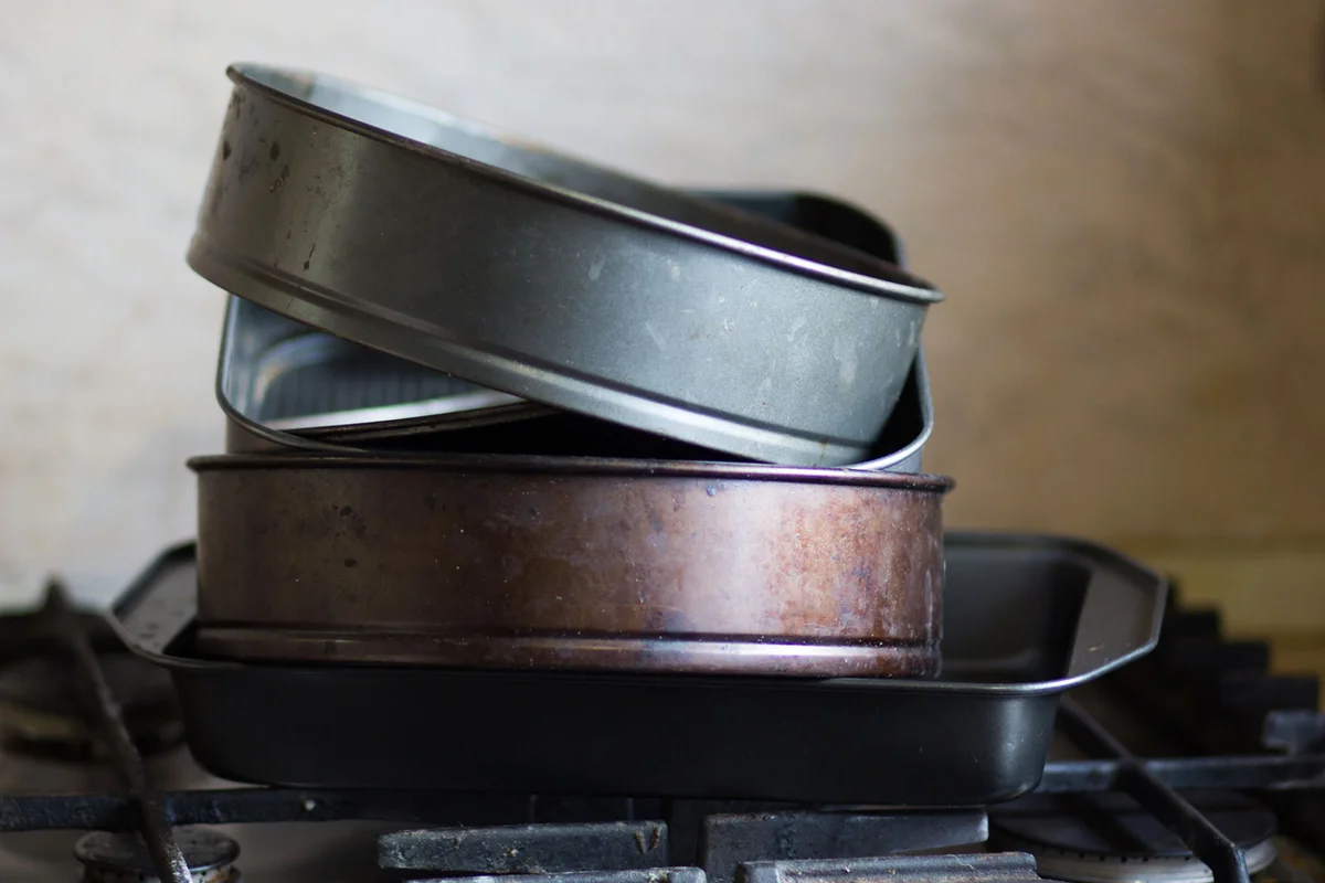 stack of tarnished cake pans