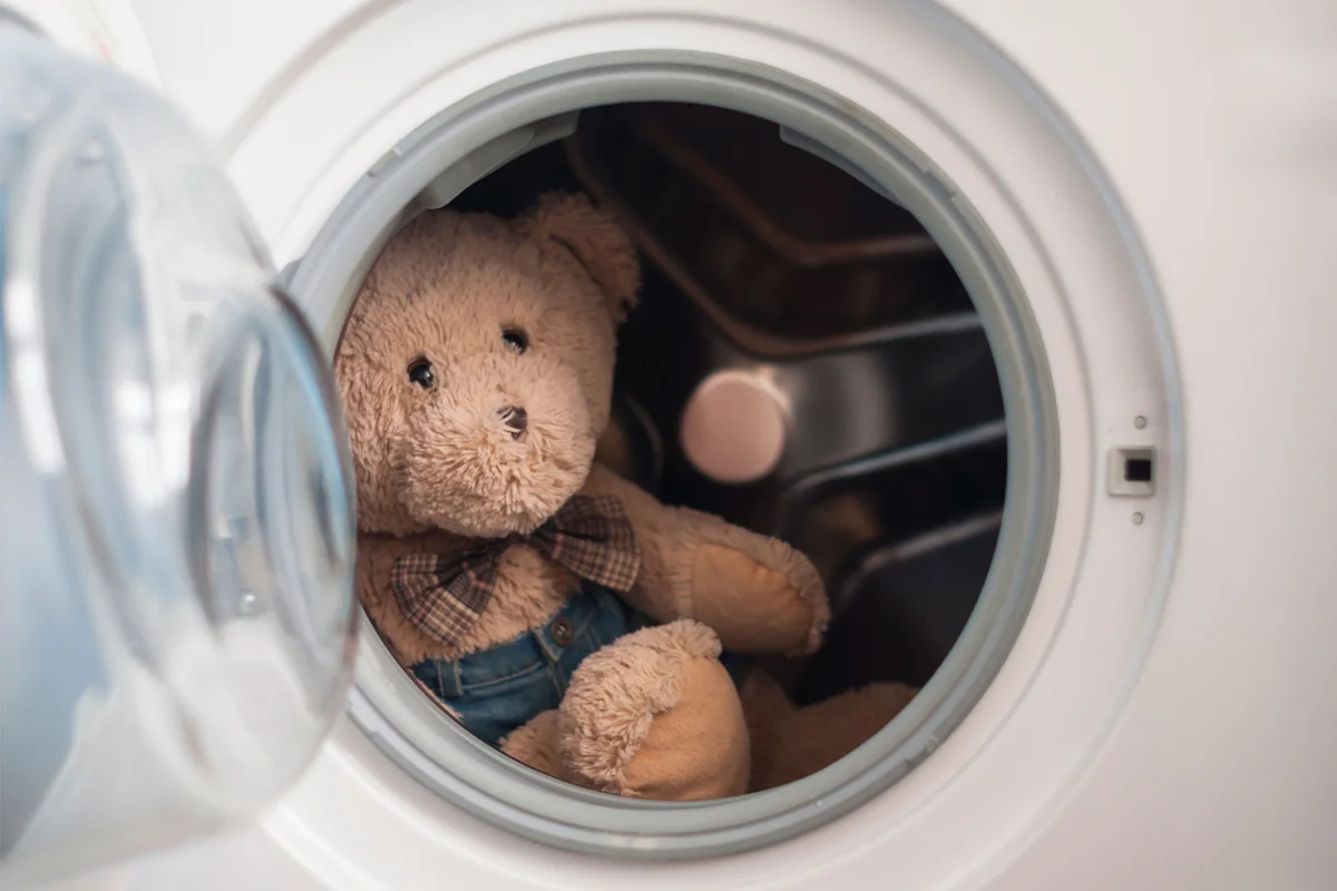 teddy bear stuffed animal in washing machine