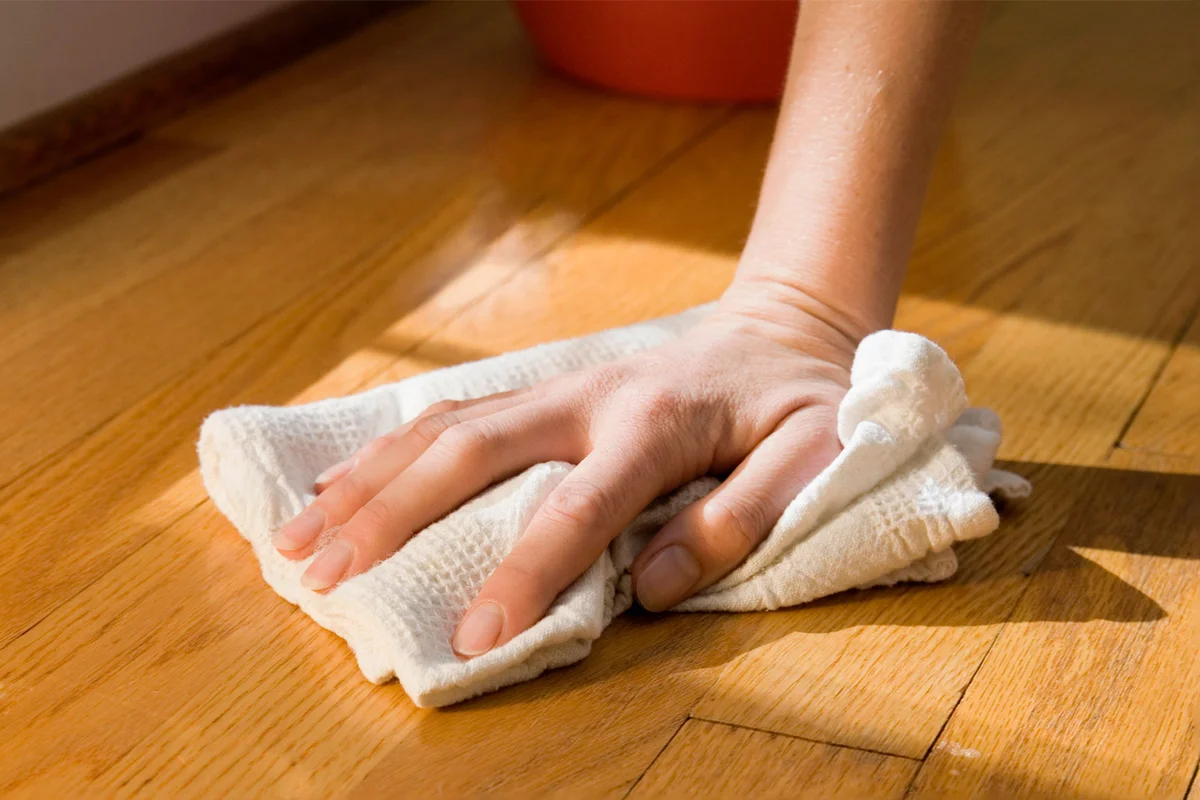 polish wood floor with cloth