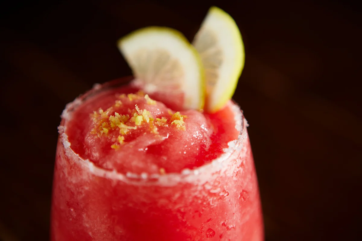 Zesty Frozen Daiquiri with cut lemon