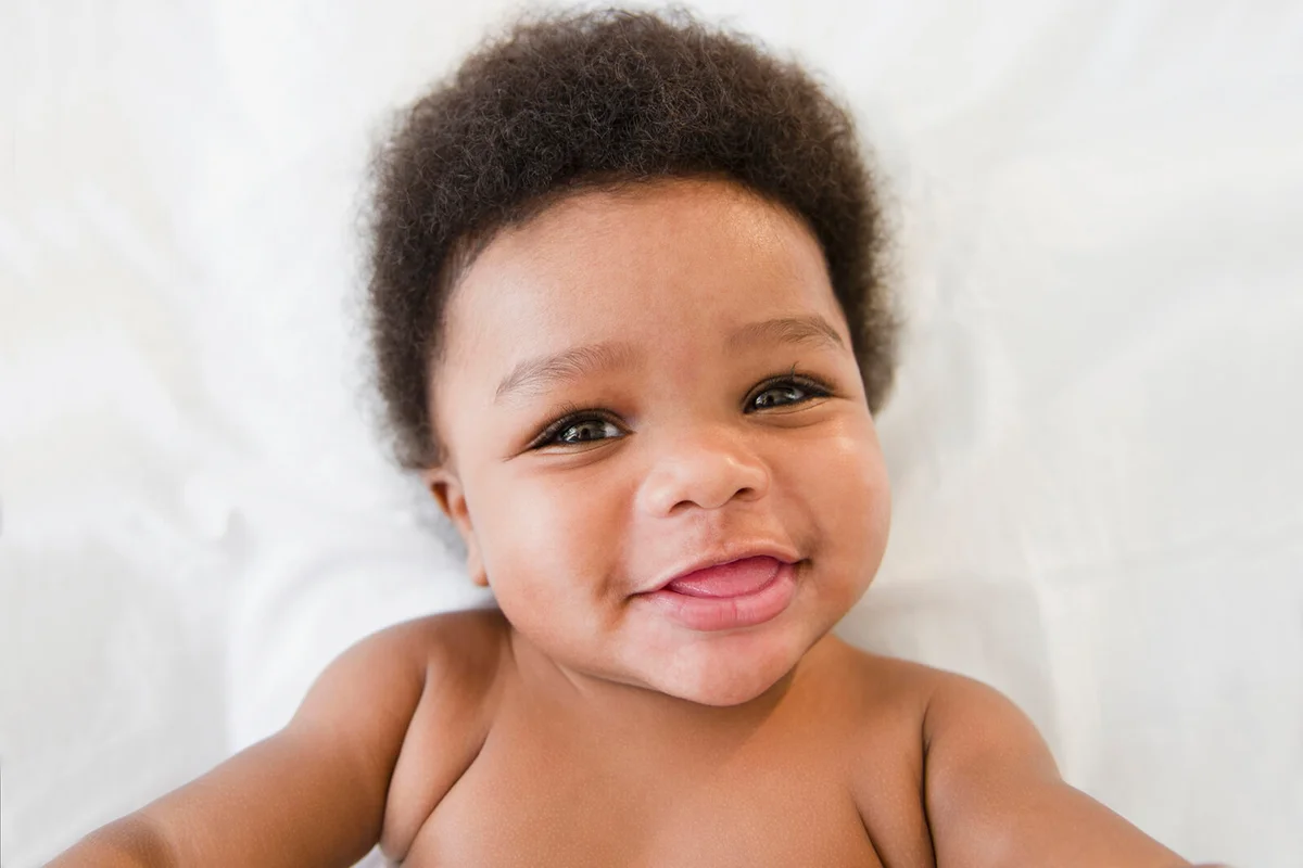 Smiling baby boy looking at camara
