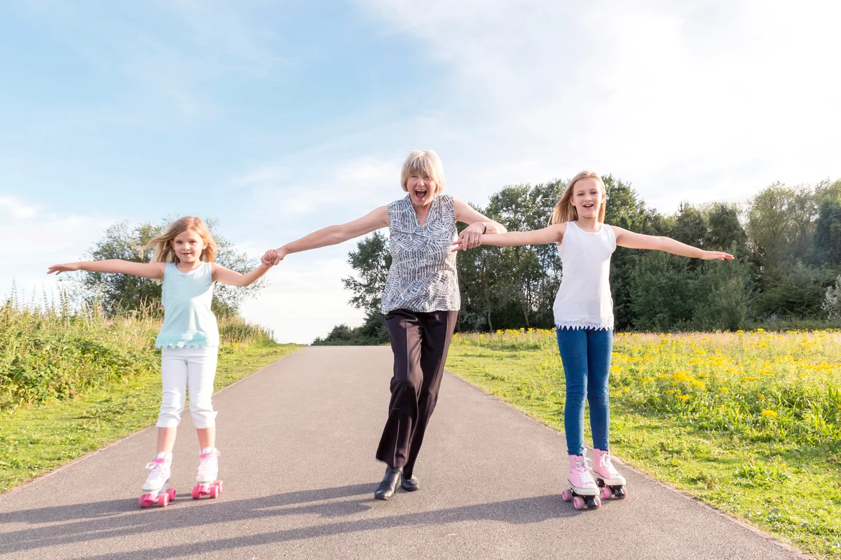 Grandmother and granddaughters roller skating