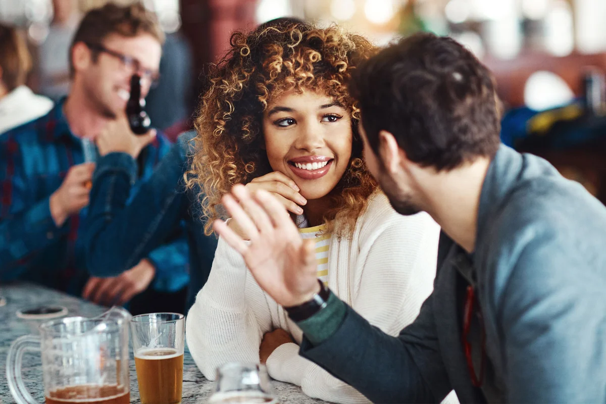 shy woman receiving compliment on date