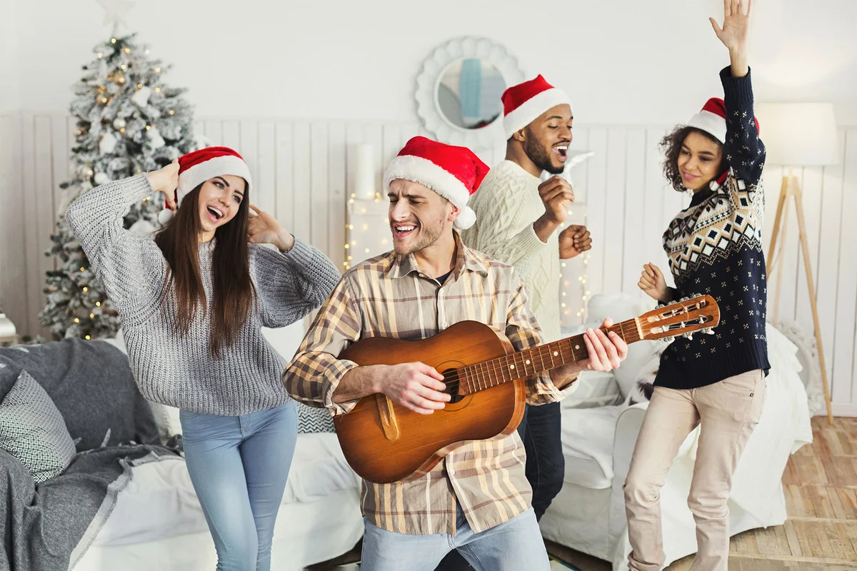 group of friends singing Christmas parodies