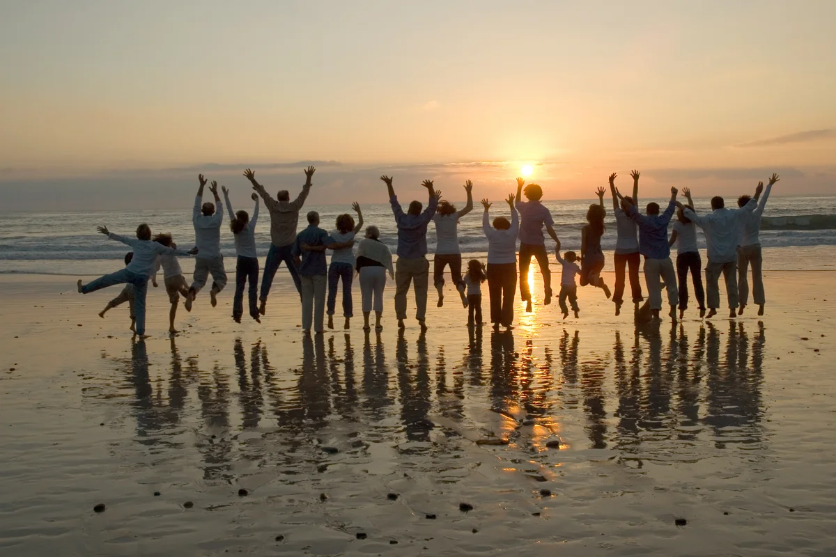 Family jumping at the beach
