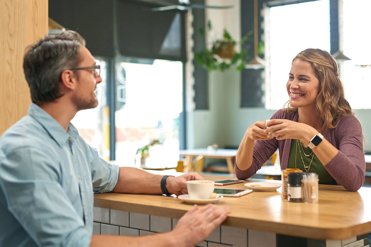 couple meeting in public cafe from online dating site