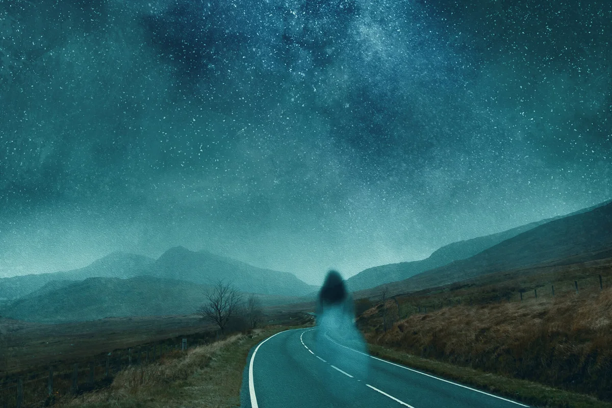 ghostly transparent woman. Floating above a mountain road