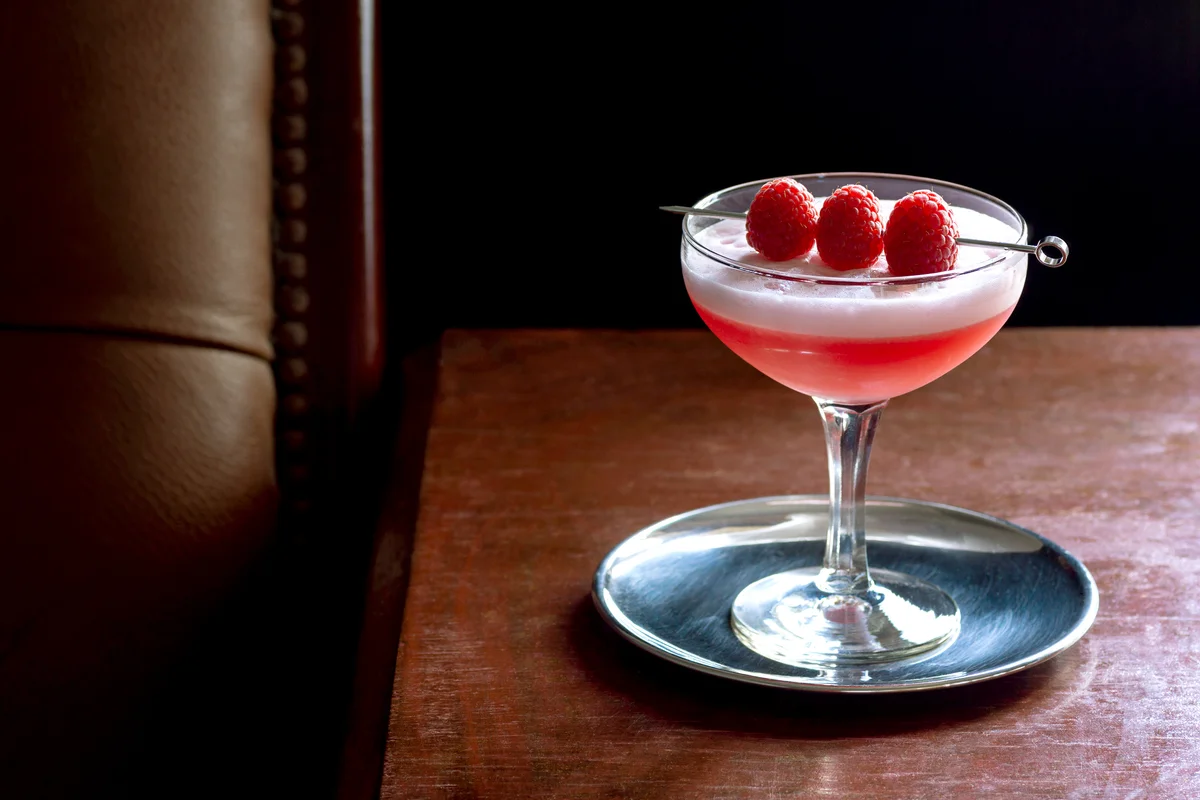 Clover Club Cocktail with Gin, Raspberries, and Egg White Foam