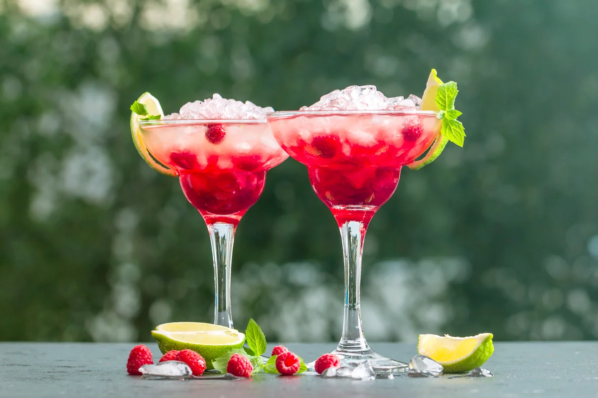 Cocktail with lime and raspberries