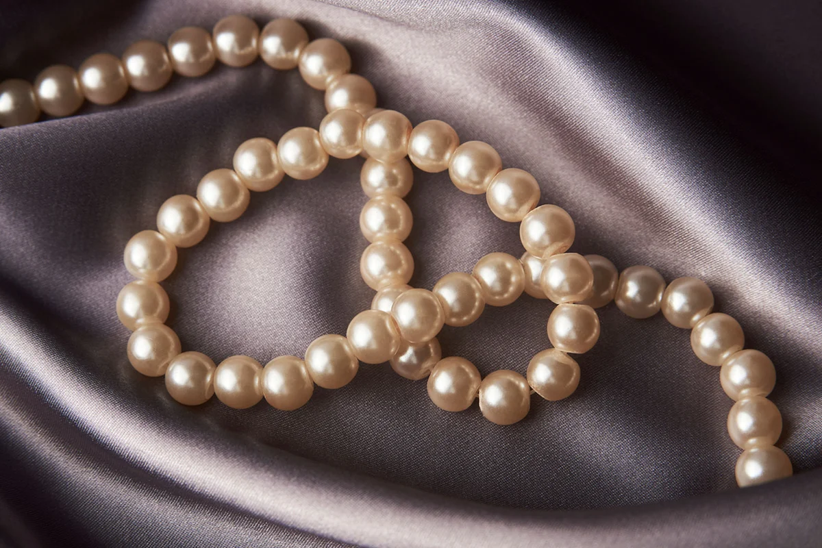 pearl necklace on silky fabric