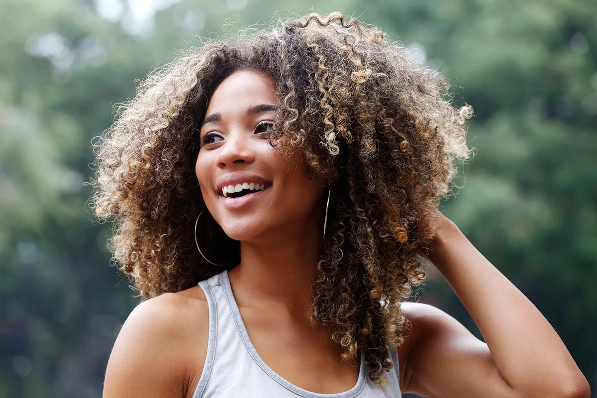 Young Latina woman laughing