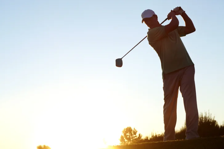 golfer in mid backswing