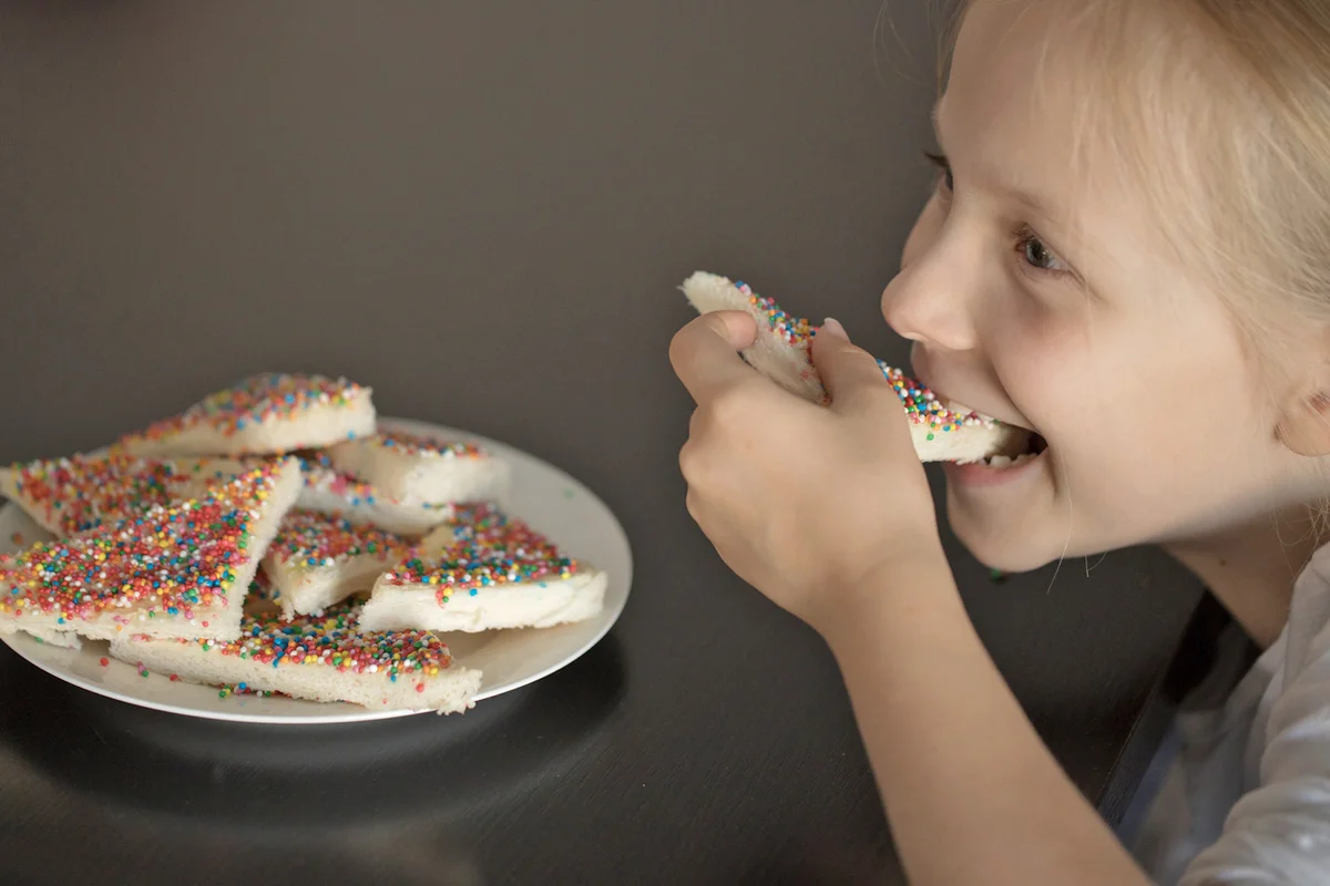 Young Australian girl eating fairy bread