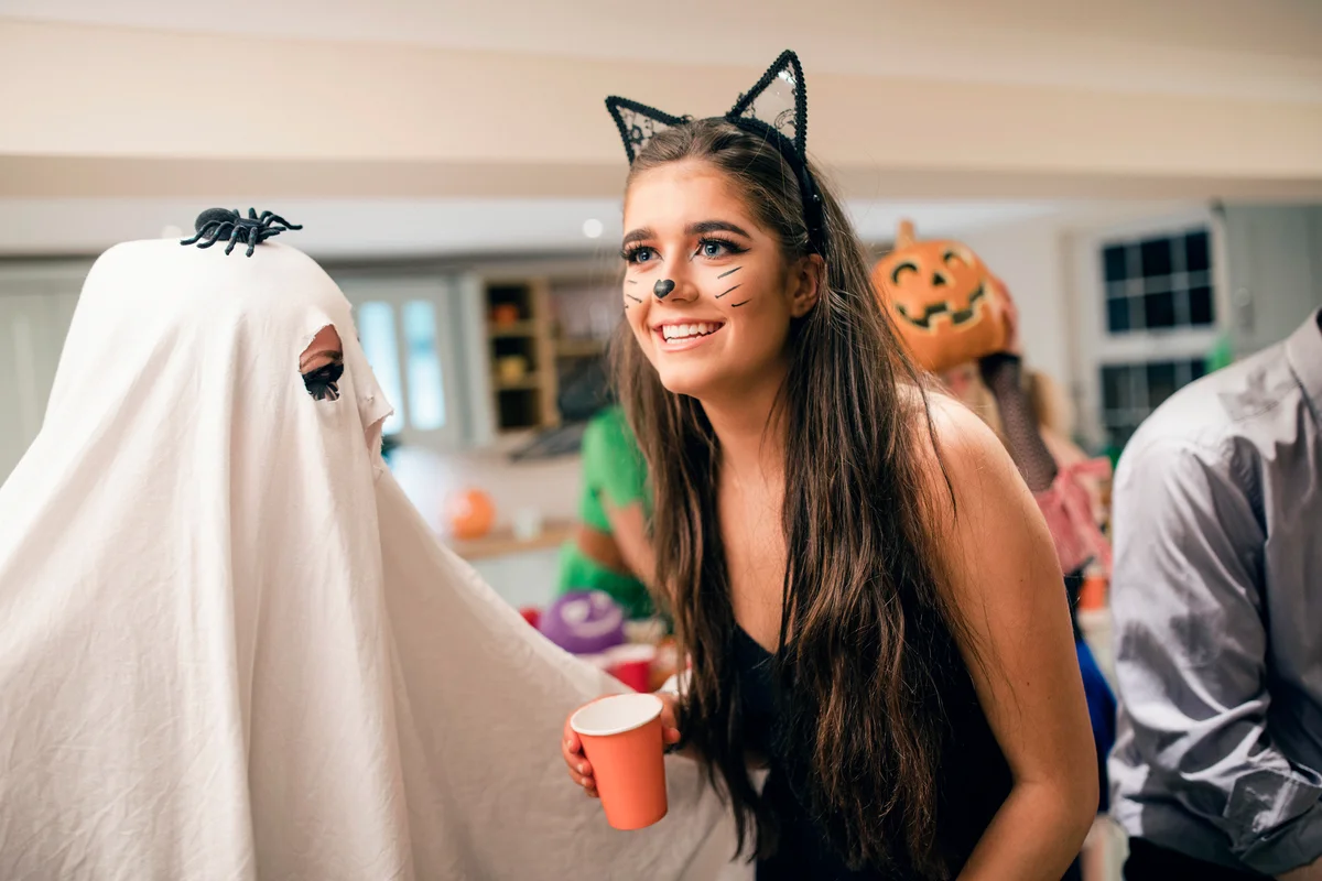 Girl dressed as a cat in a Halloween party