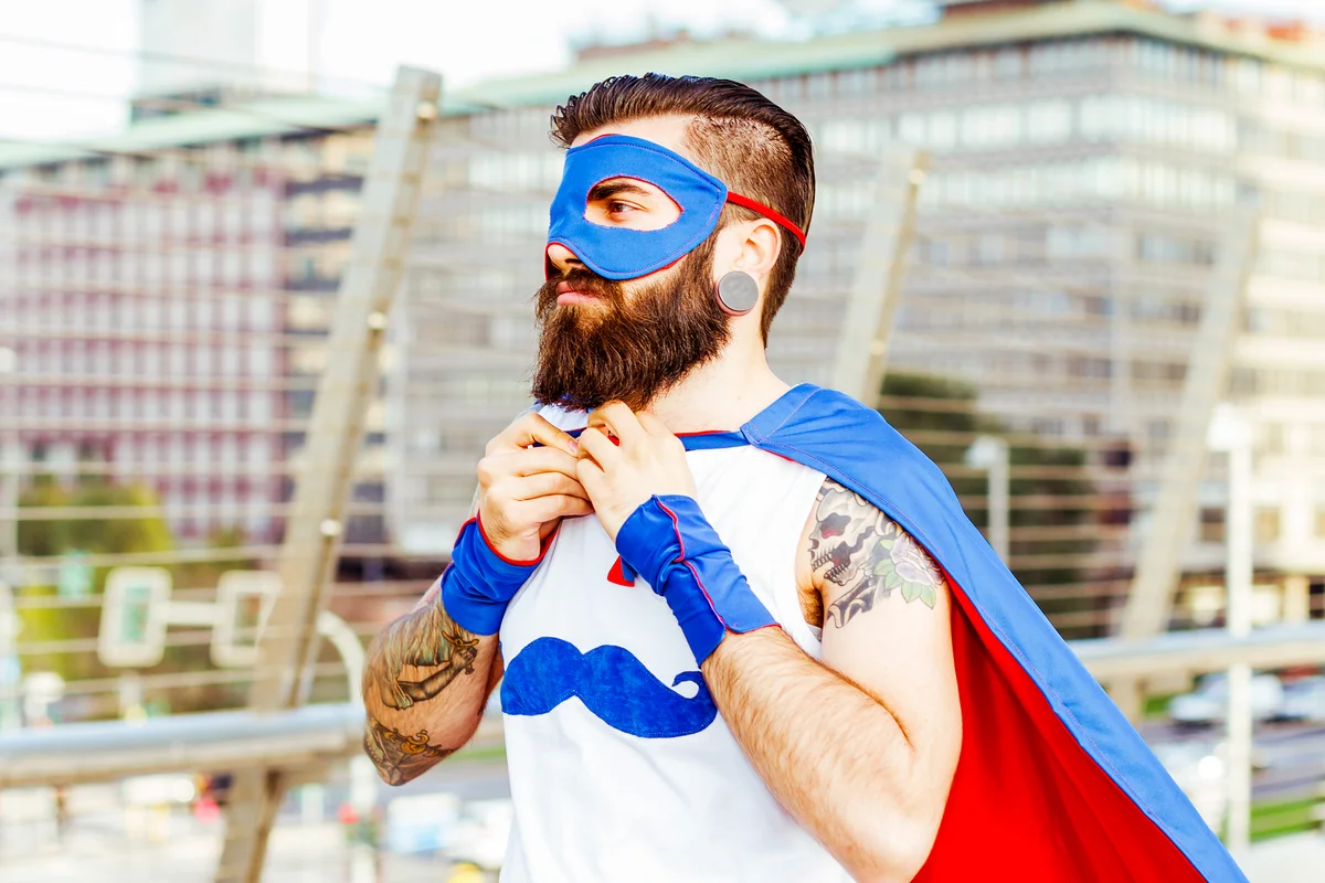Hipster superhero adjusting his mantle