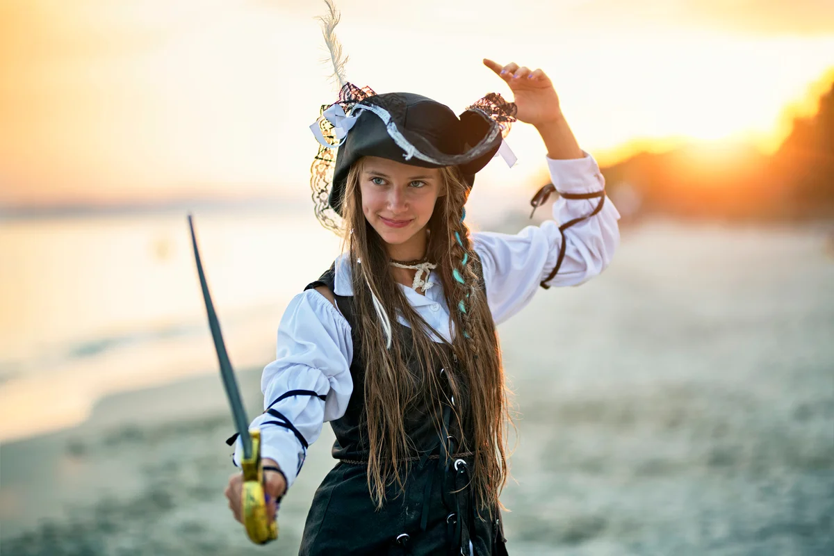 Cute pirate girl holding a sabre