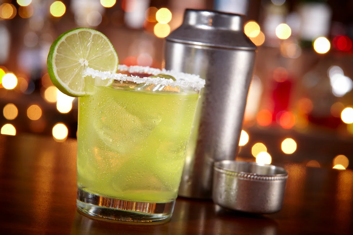 A margarita in a rocks glass at a bar