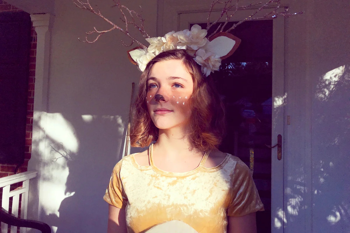 Teen girl dressed as a woodland deer
