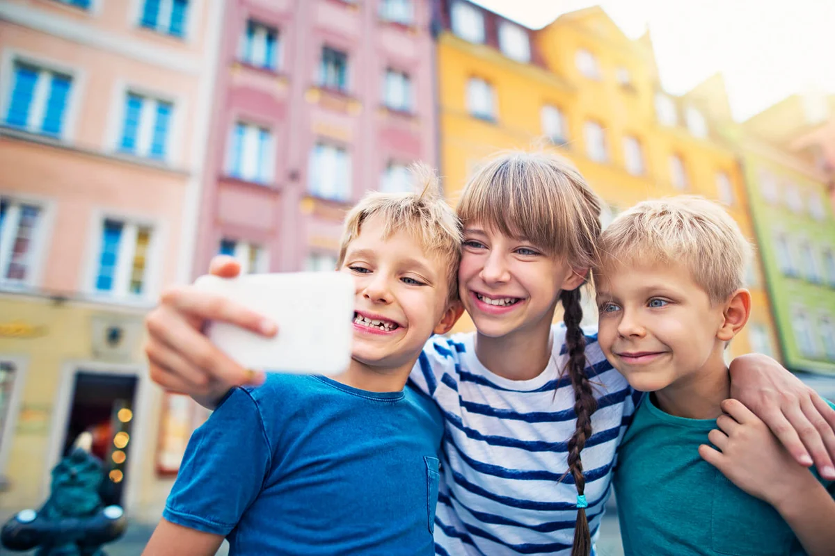Little girl with her younger brothers are visiting Wroclaw, Poland