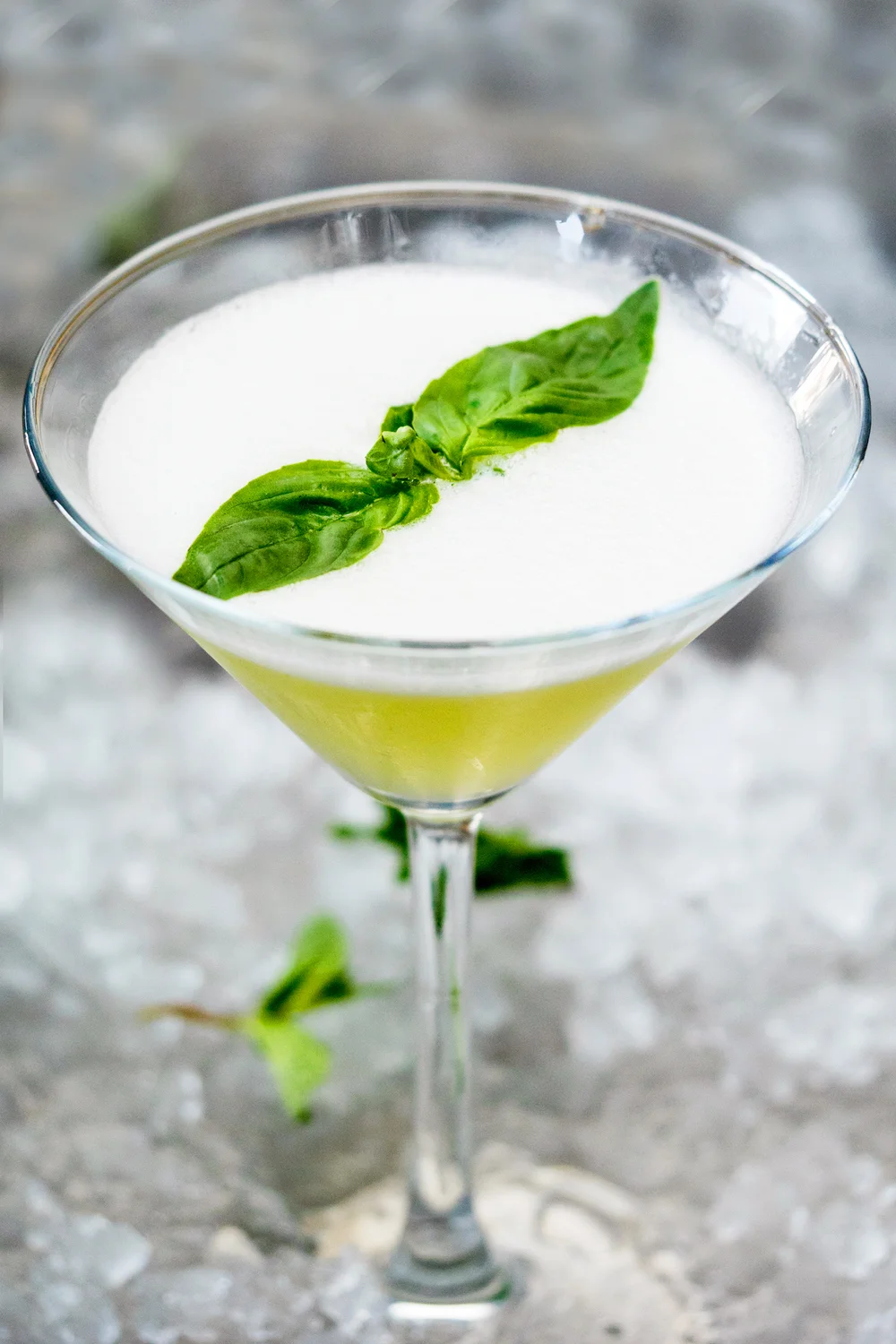Apple martini Cocktail Garnish With Mint In Glass On Crushed Ice