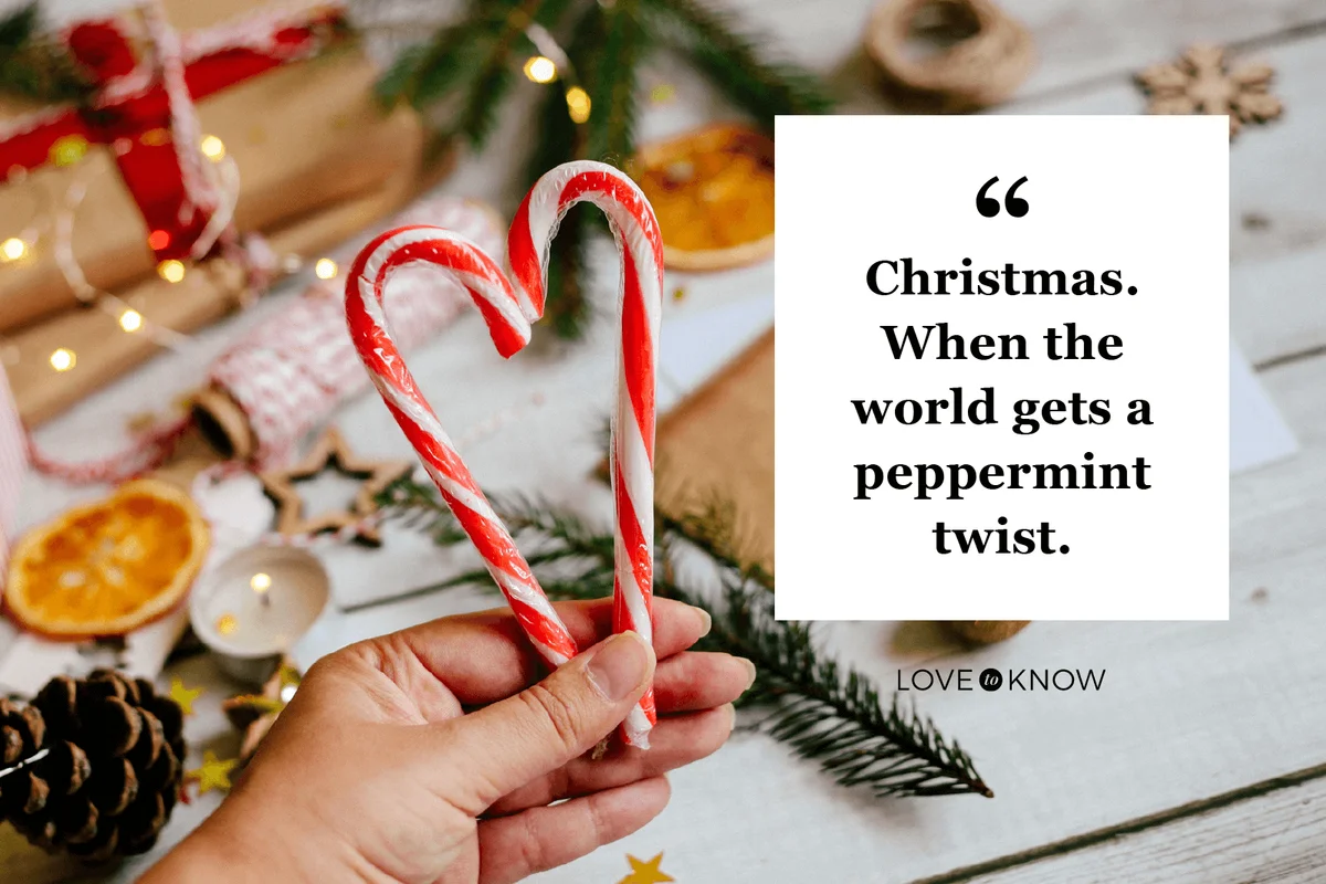 Candy canes in female hand in shape of heart