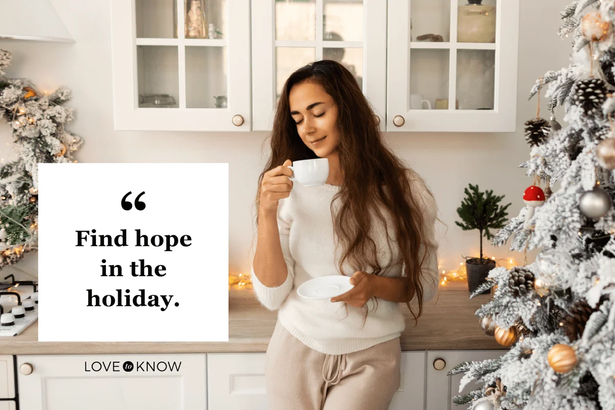 Young woman enjoying coffee while standing at kitchen in Christmas morning