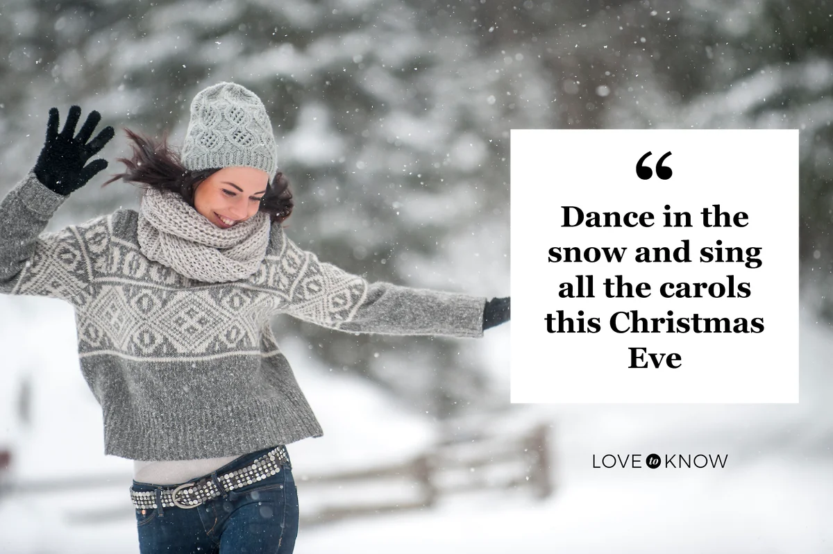 Woman wearing knitwear dancing in the snow