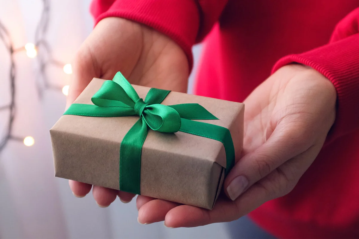 give gift present with green ribbon