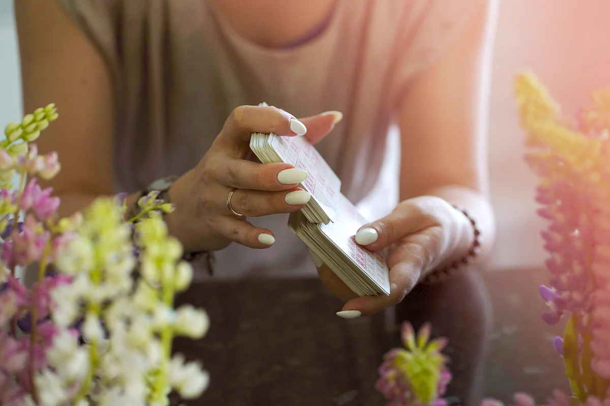 Tarot cards in hands