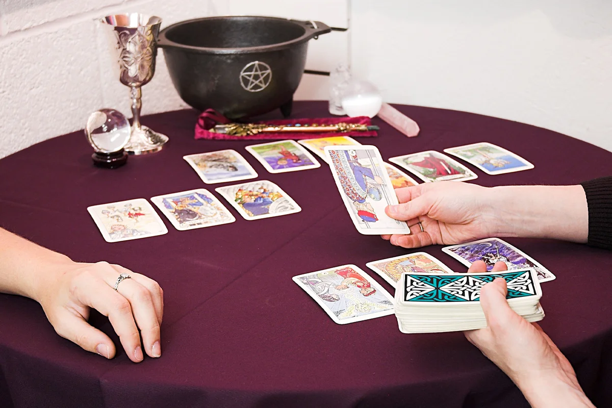 Woman telling another woman's future with tarot cards