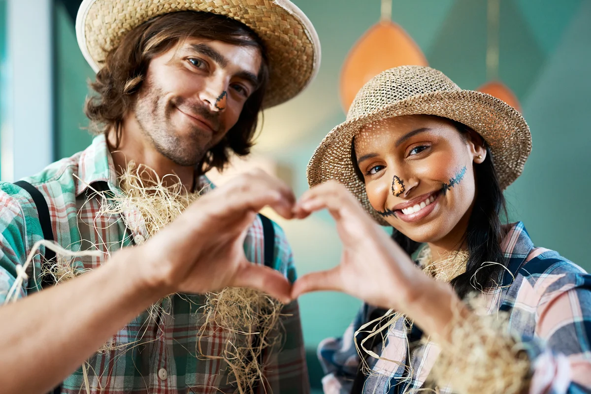 Young Couple Making Heart Gesture Scarecrows Costumes