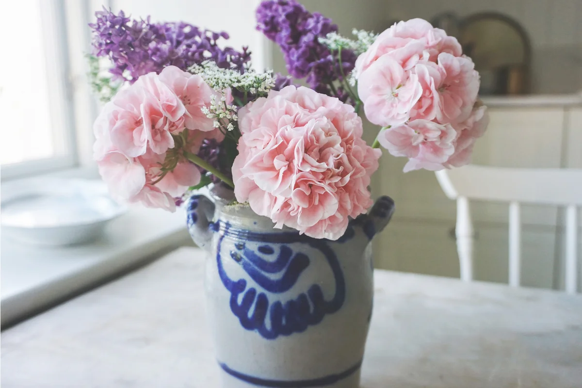 Pink Flowers Vase On Table