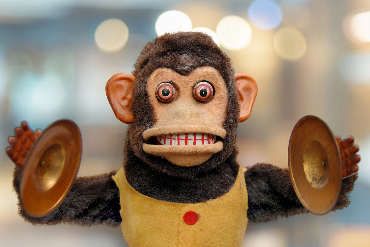 Vintage mechanical monkey toy with cymbals