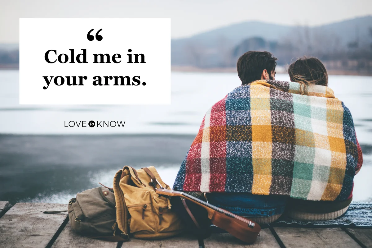 Romantic Young couple hugging by the lake in winter
