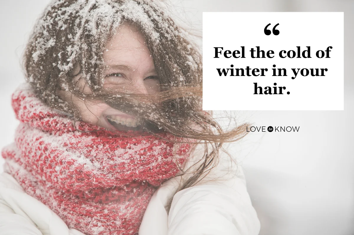 Teenager girl under snowfall at the street