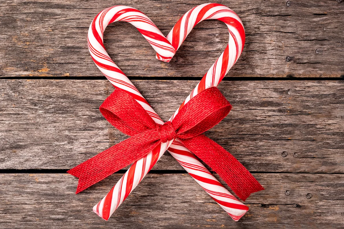 candy cane heart shape wrapped with red ribbon