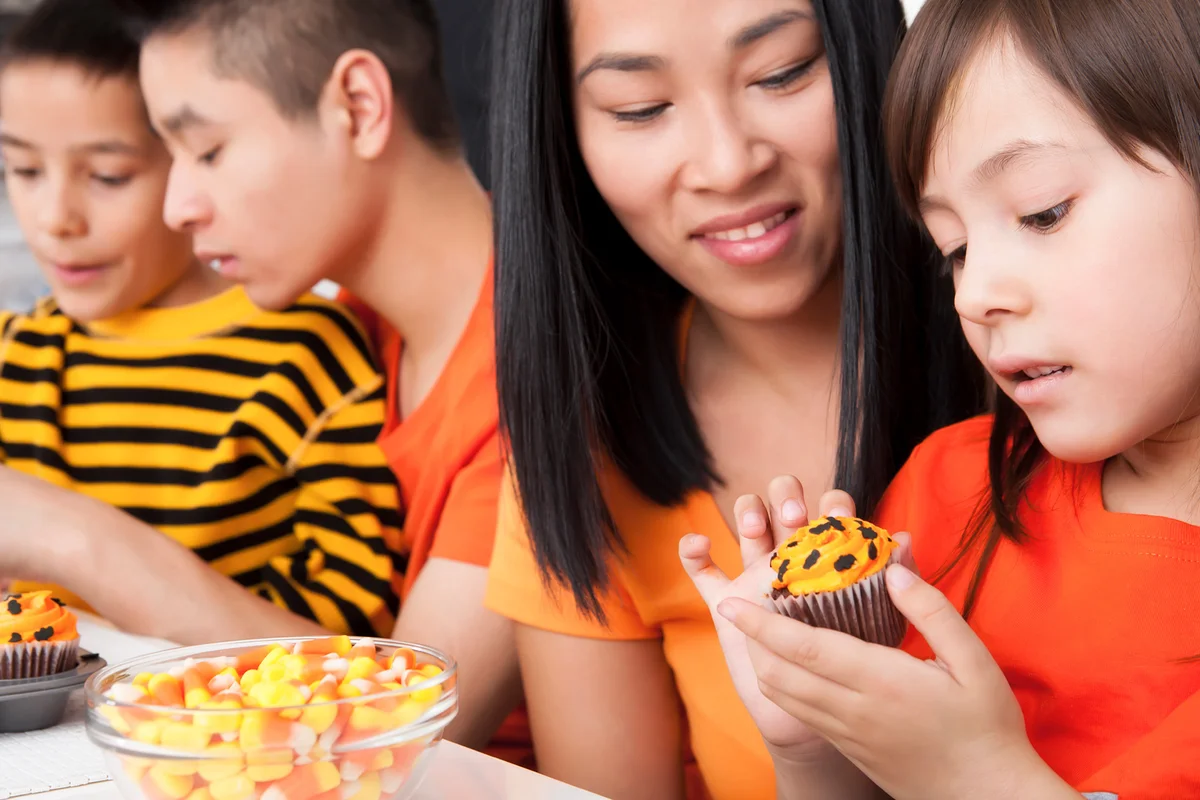 Family eating halloween cupcakes