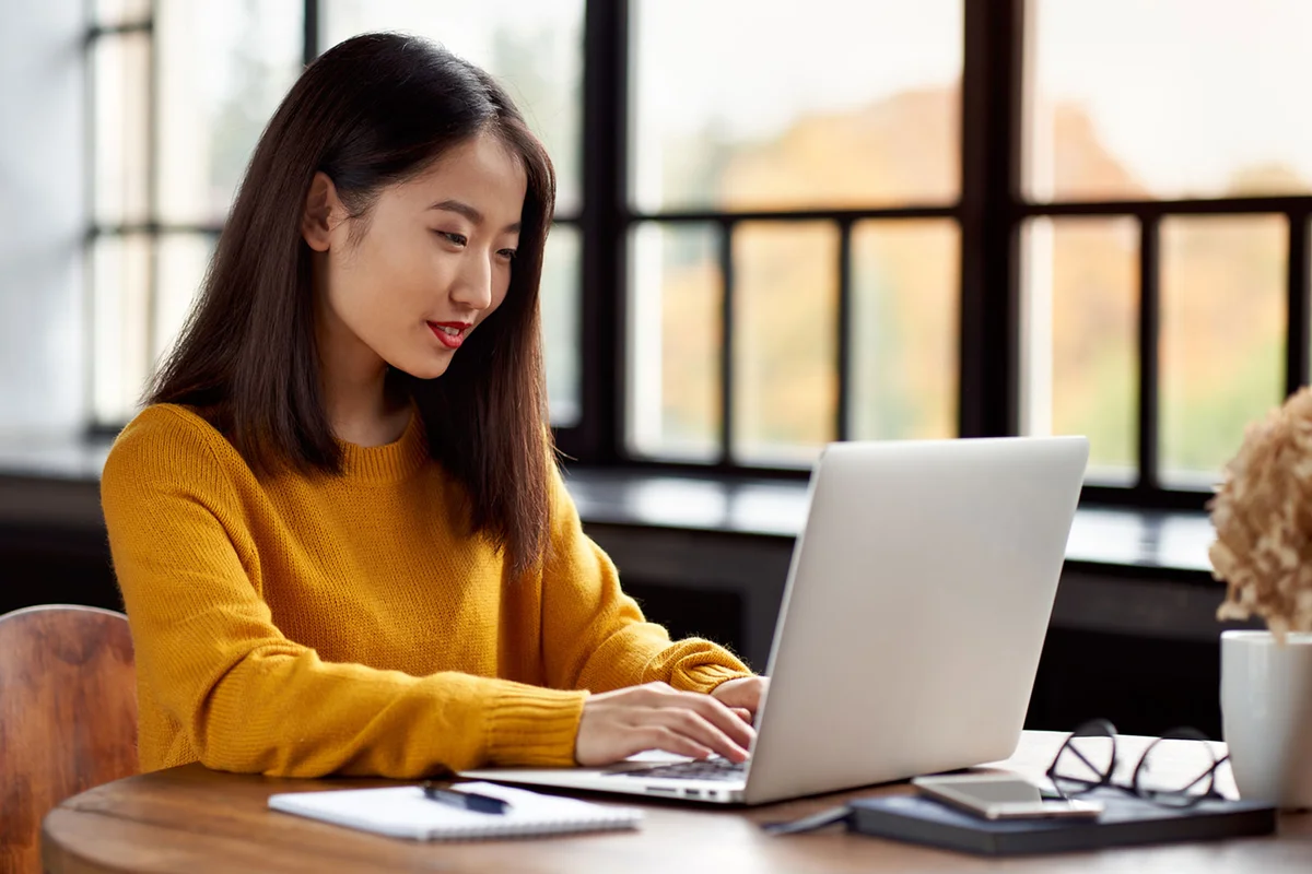 woman writing business letter on laptop