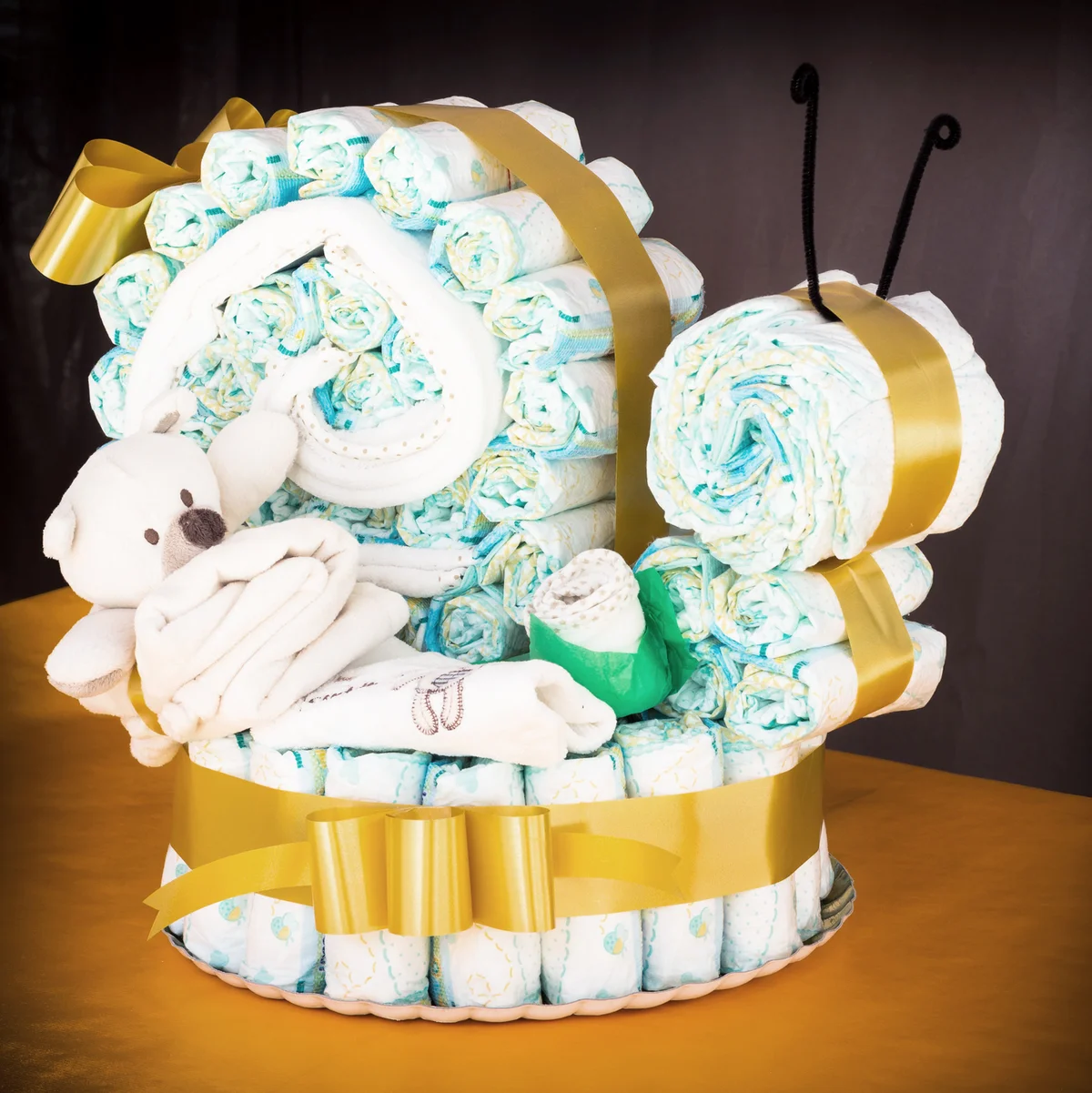 Diapers rolled up to create a diaper snail cake