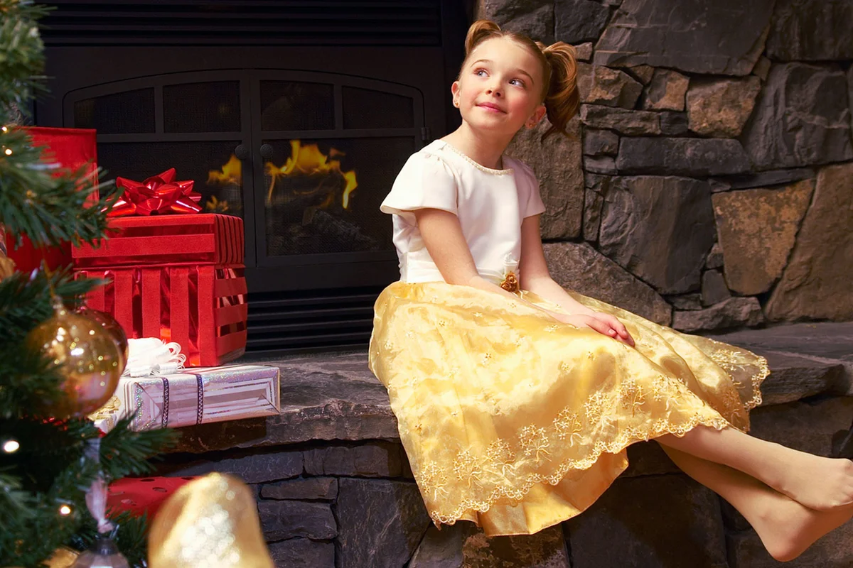 girl wearing gold dress Christmas holiday