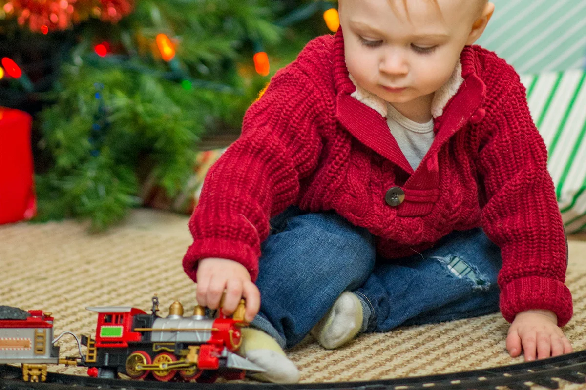 boy wearing red sweater on Christmas Eve