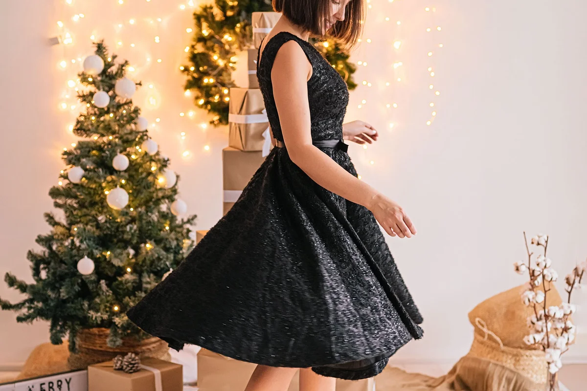 woman wearing black dress on Christmas Eve