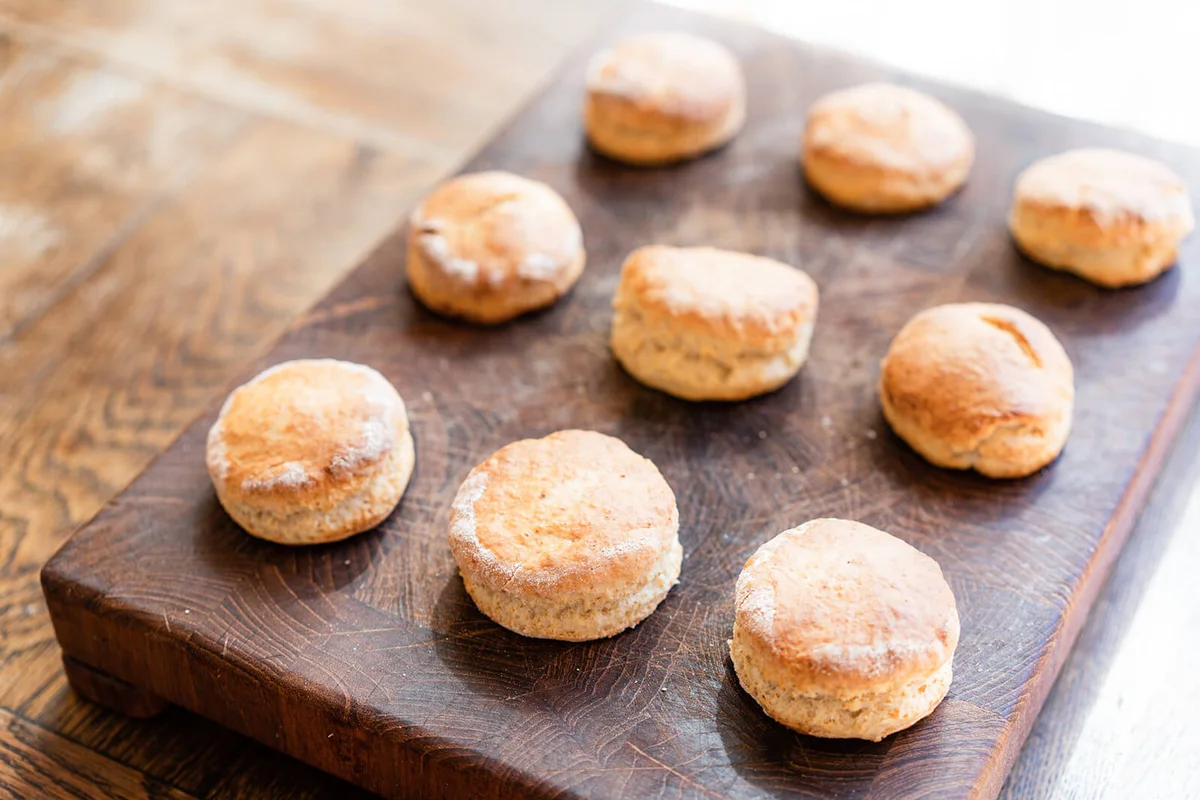 freshly baked scones on wooden board