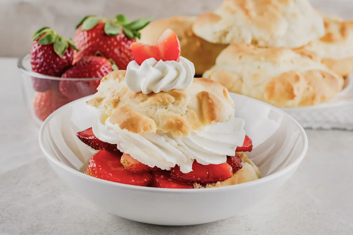 Strawberry shortcake in shallow white bowl