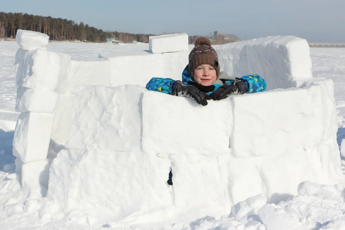 Boy Building Snow Fort