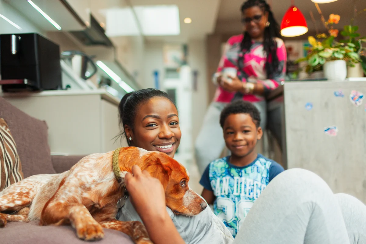 family of two moms son and dog