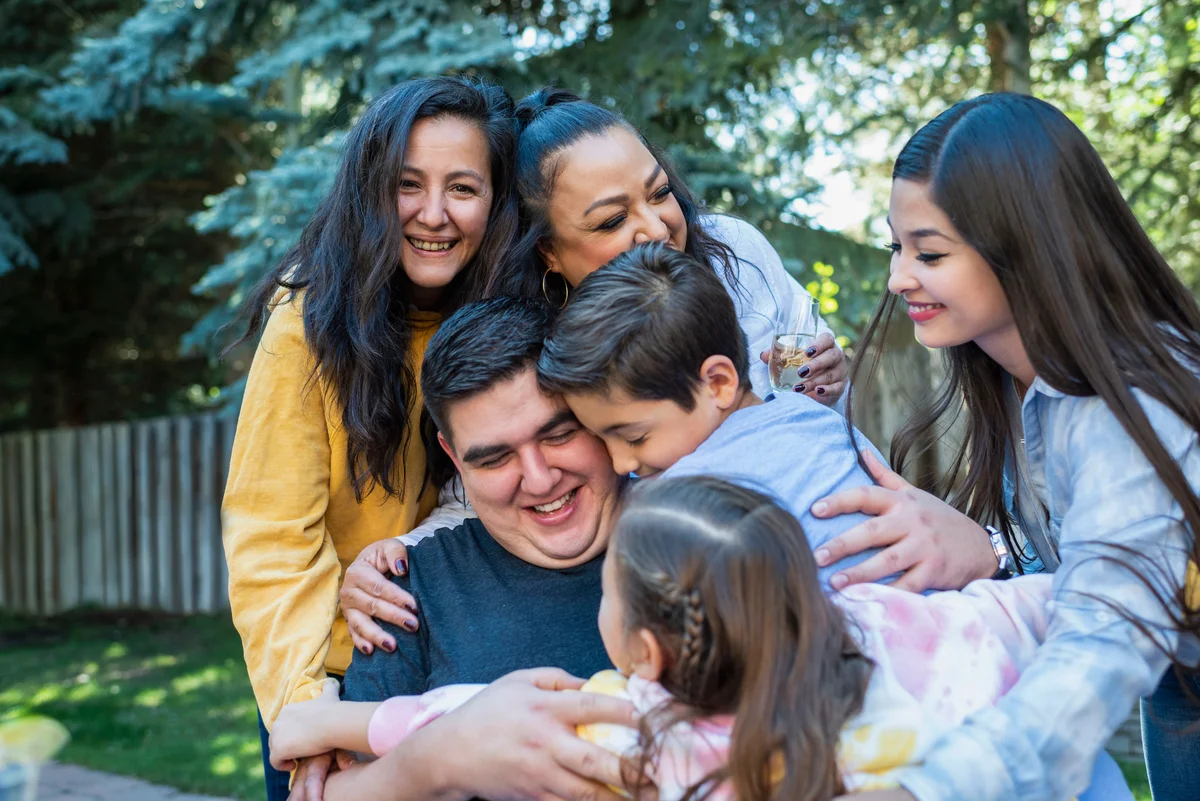 family group hug around father