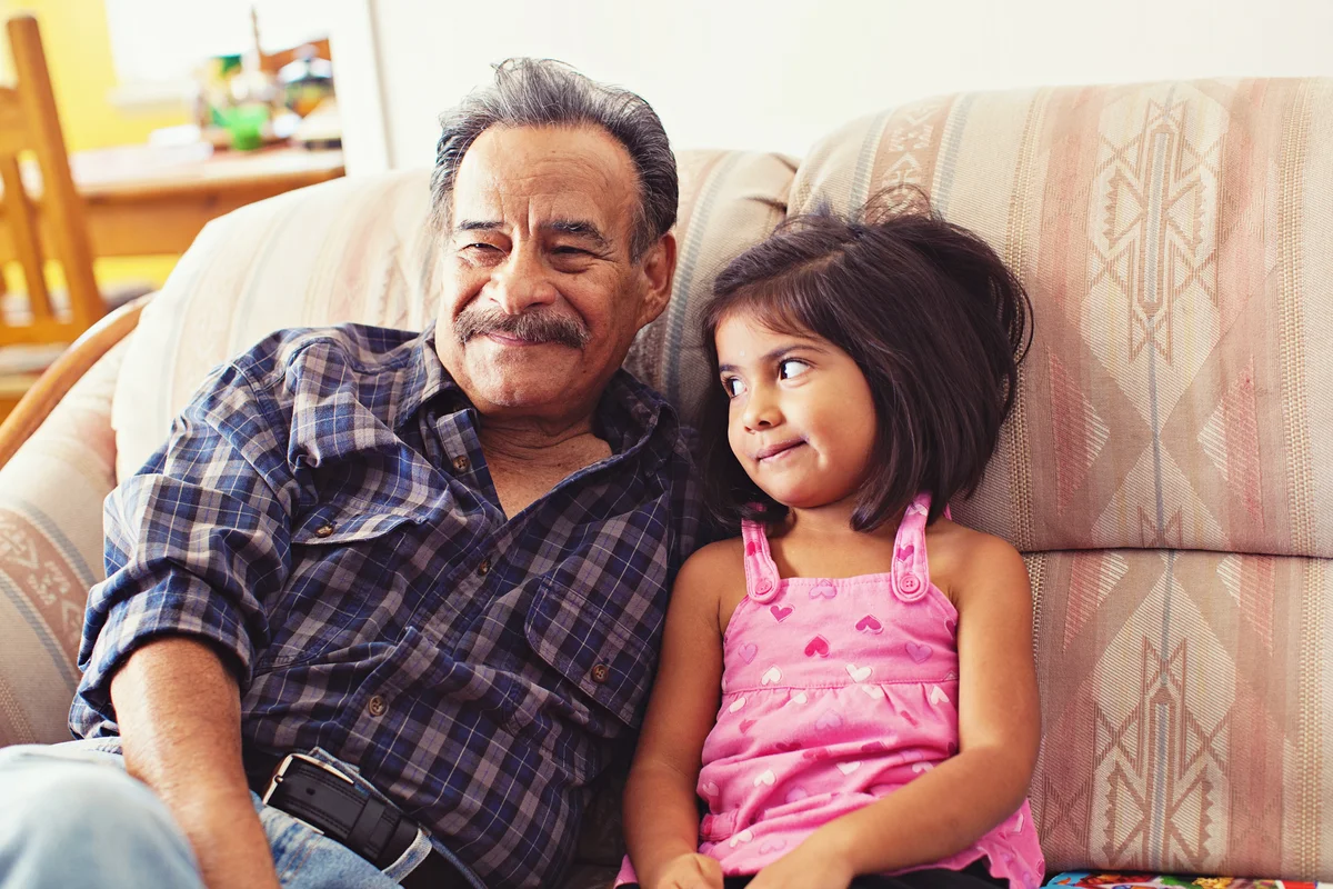 granddaughter looking at grandfather