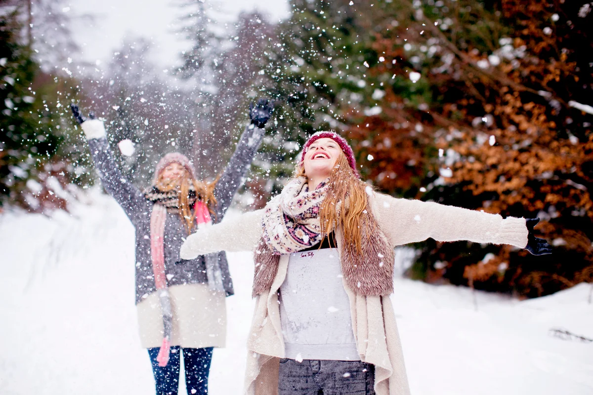 Sisters having fun in snow